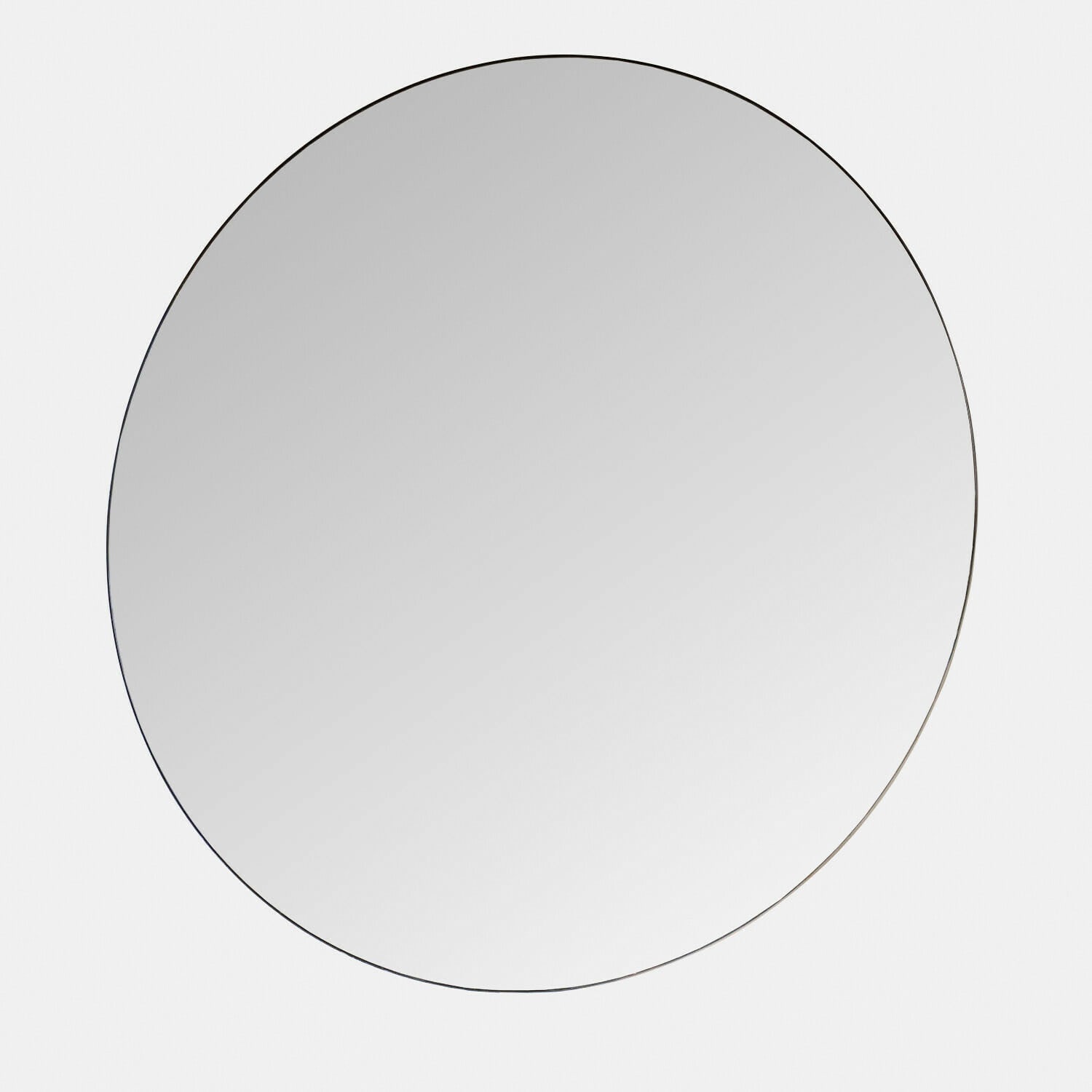 Miroir rond sans cadre au design minimaliste, parfait pour une décoration intérieure moderne