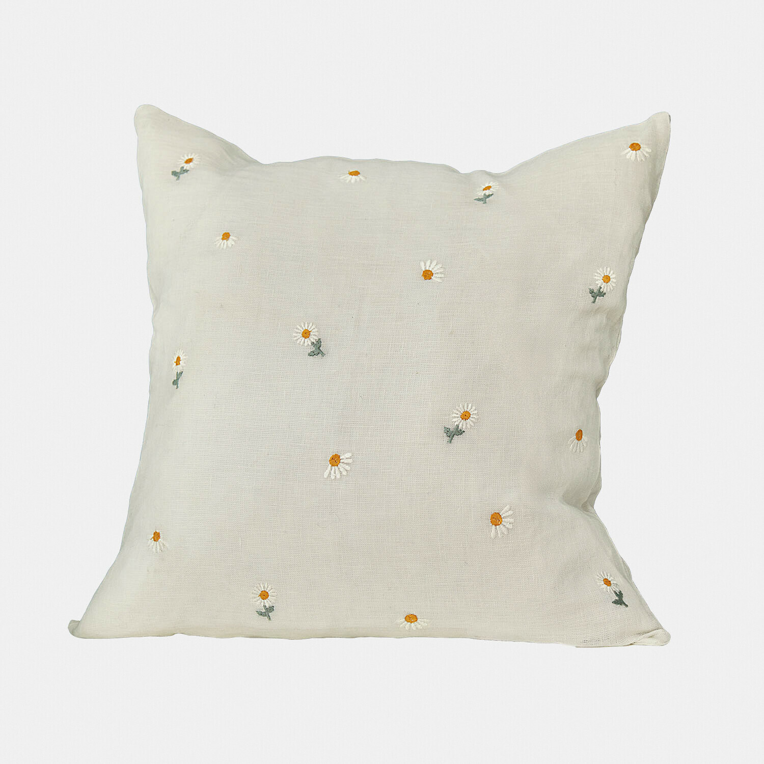 Coussin beige en lin avec broderies de marguerites blanches et jaunes, décoration d'intérieur élégante