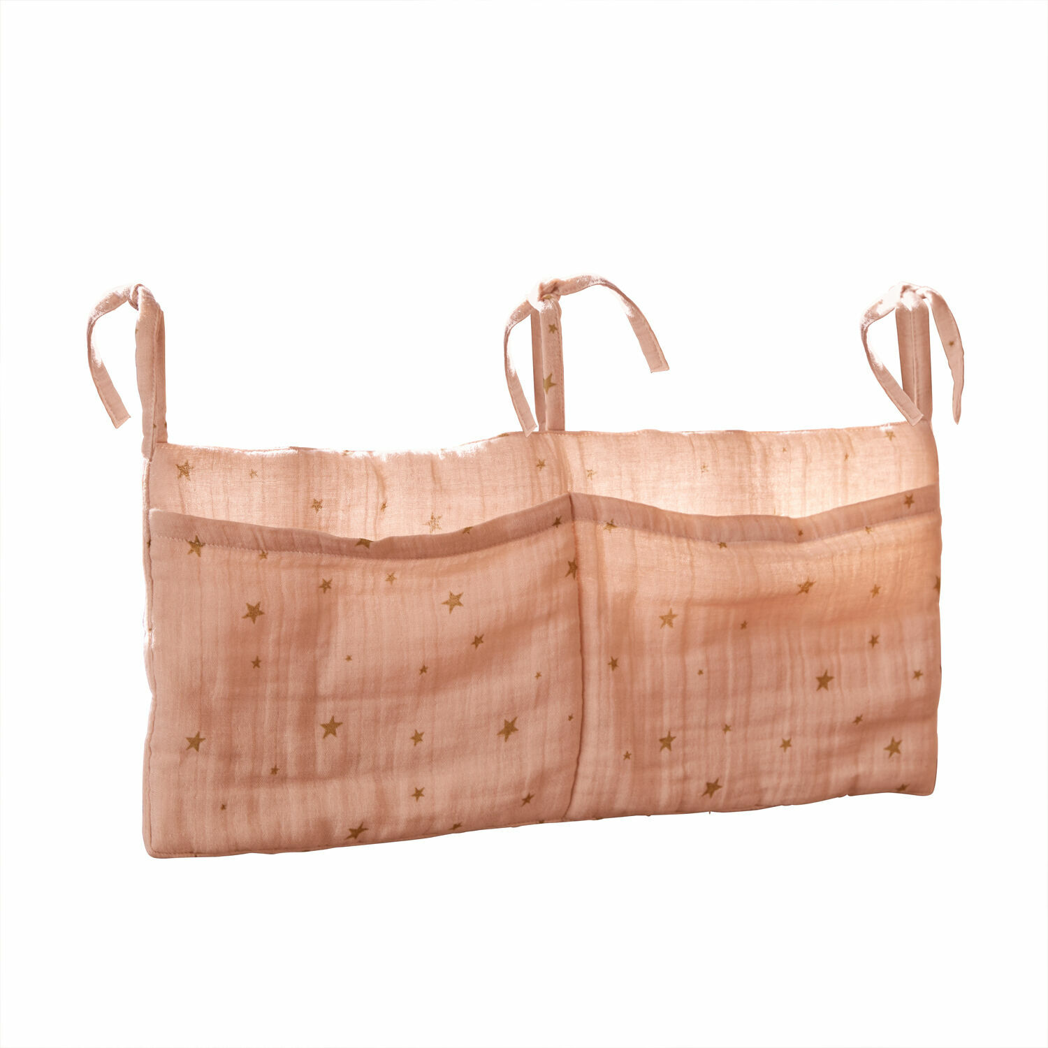 Organisateur rose en coton avec poches et étoiles dorées à suspendre dans une chambre d'enfant