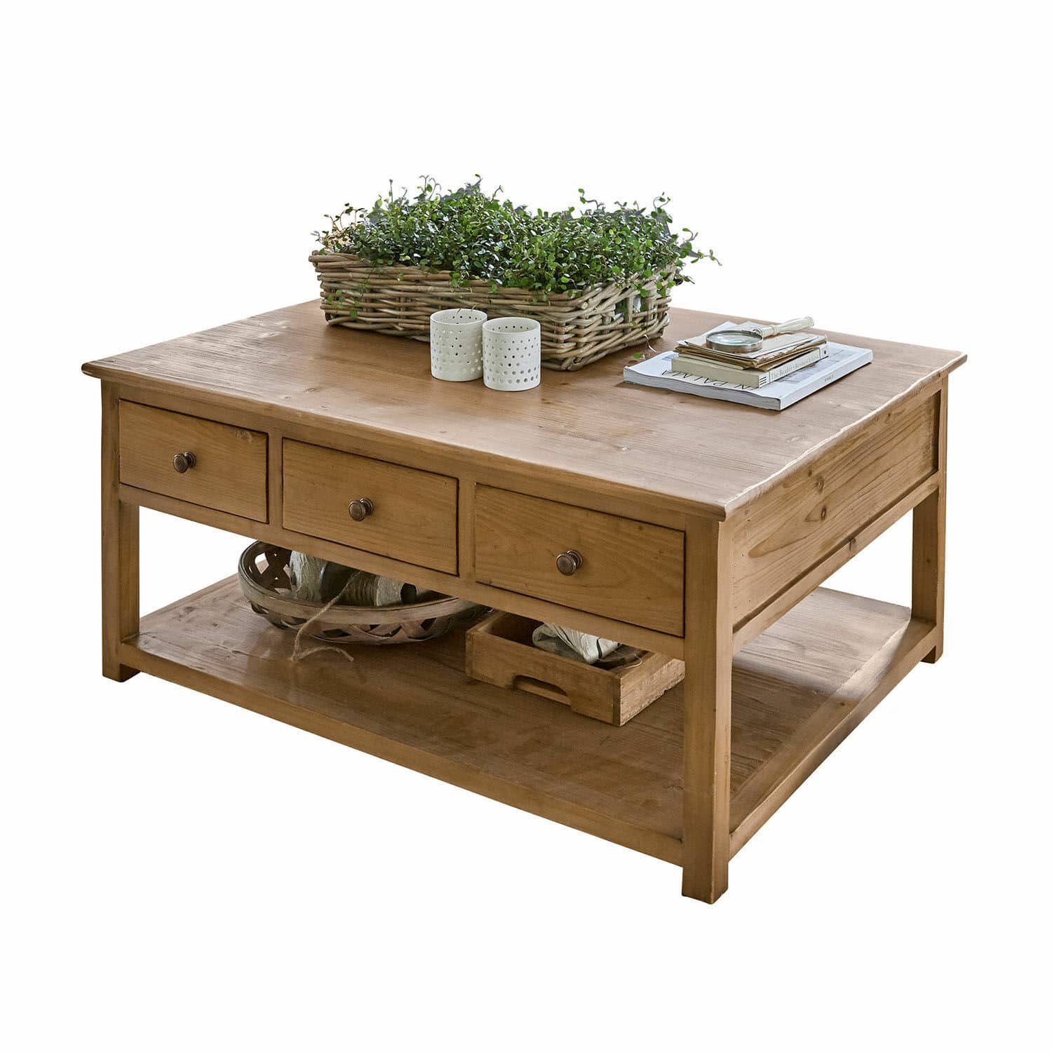 Salontafel Etienne Houten salontafel in natuurlijke kleur met drie lades en onderplank, versierd met planten en boeken