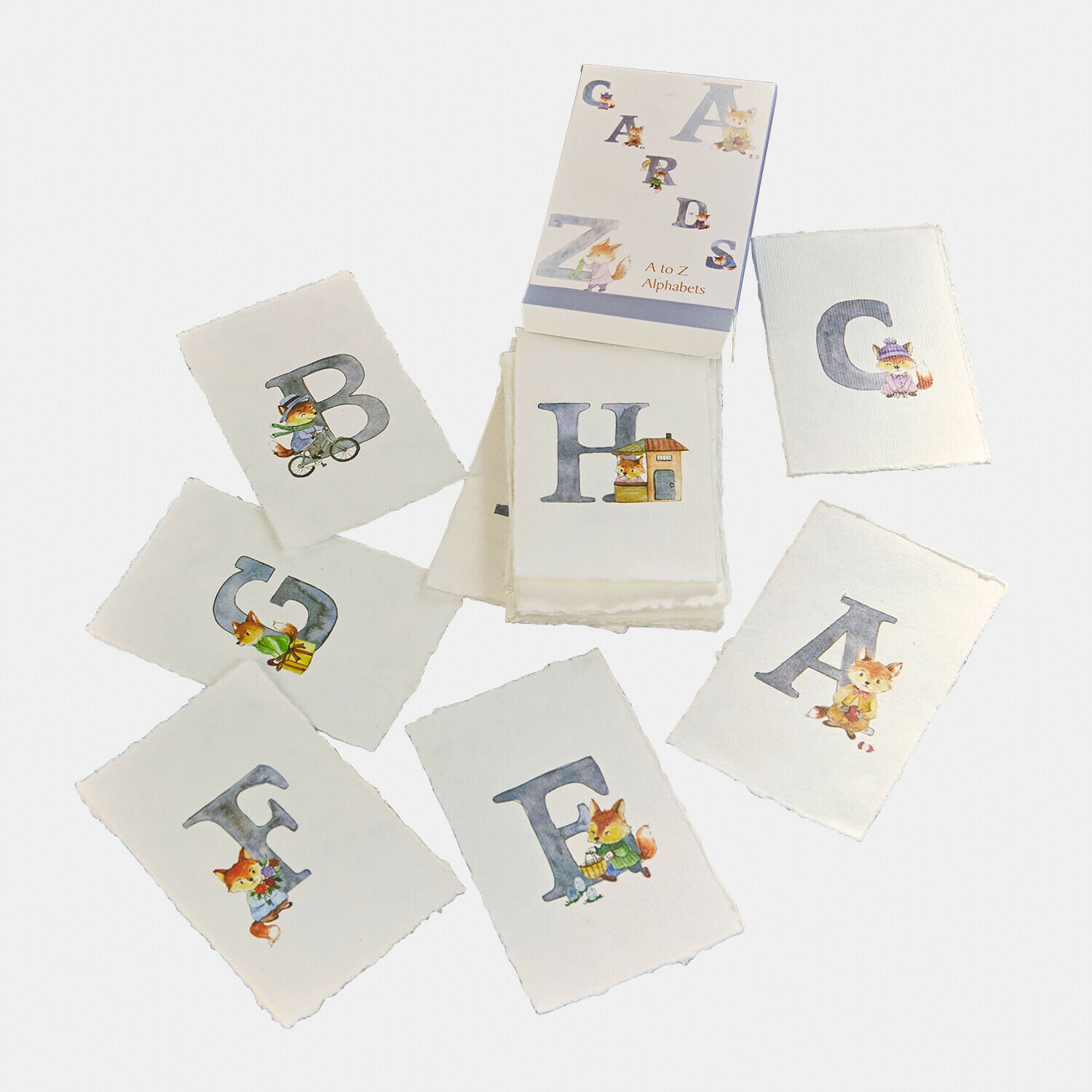 Jeu de cartes alphabétiques A à Z avec illustrations de renards sur papier blanc texturé