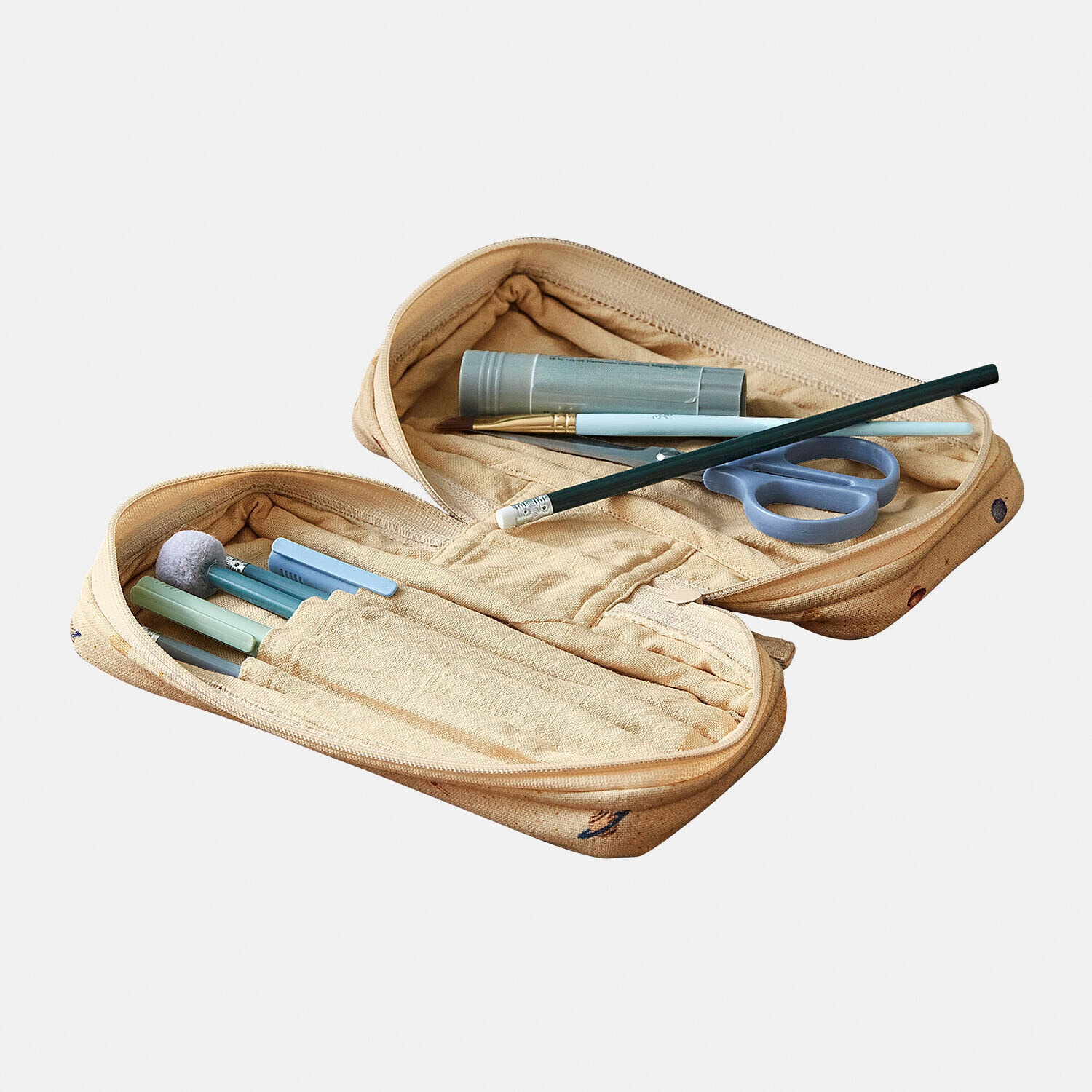 Trousse beige en tissu avec fournitures d'écriture et de dessin, organiseur pratique pour l'école