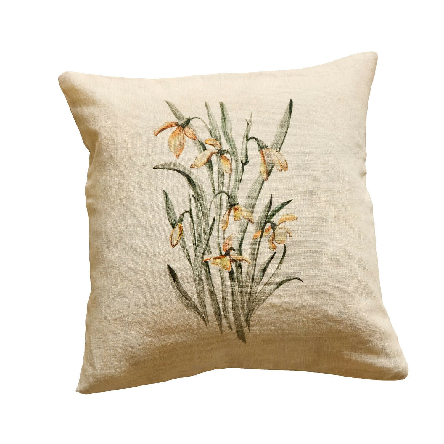 Coussin en lin beige avec motif floral jaune, décoration intérieure élégante et naturelle
