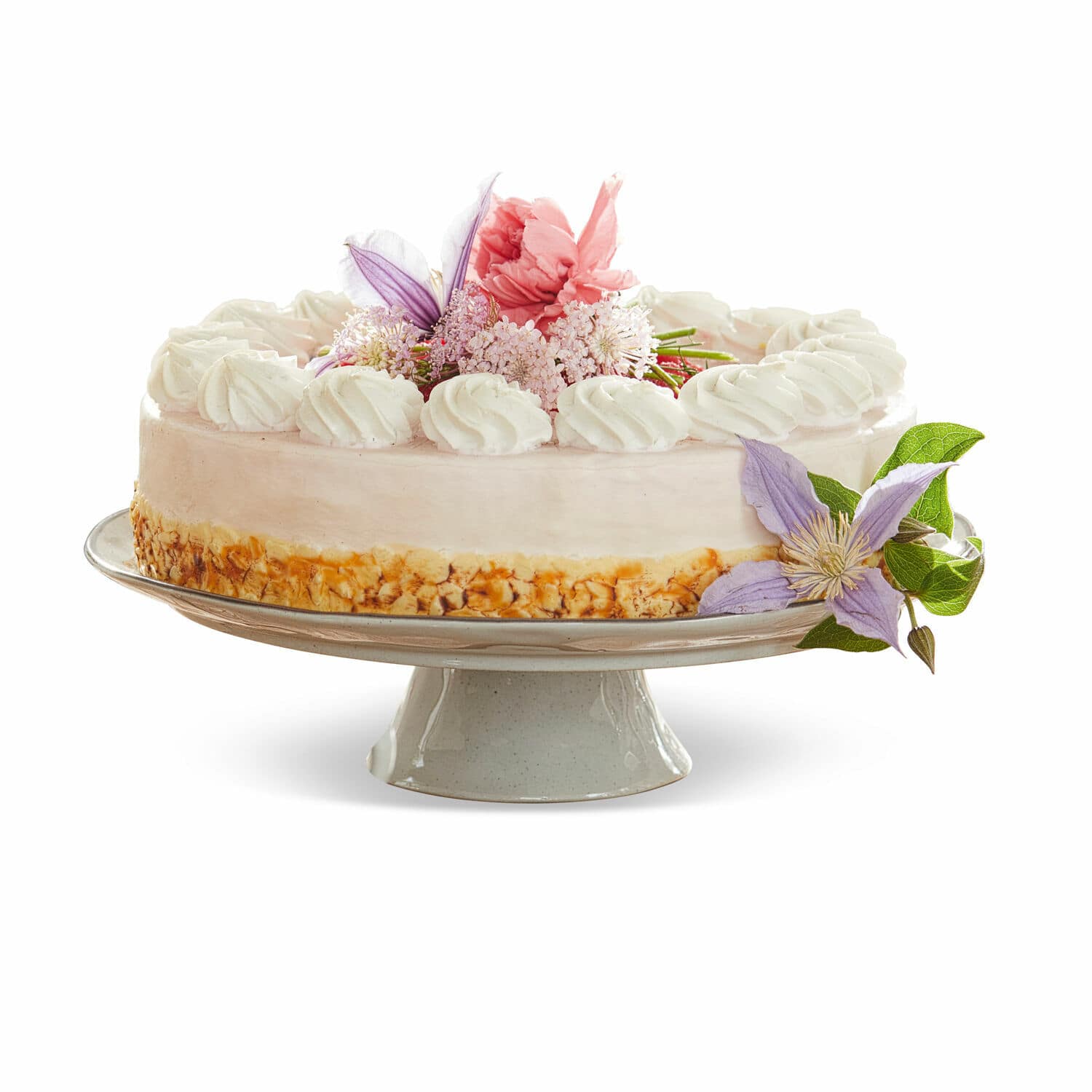 Plat Biarré Gâteau sur un support en céramique avec crème et décoration florale aux couleurs pastel