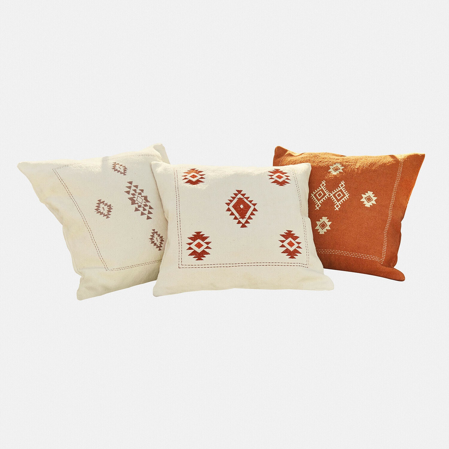 Ensemble de trois coussins décoratifs en coton crème et orange avec motifs géométriques pour salon