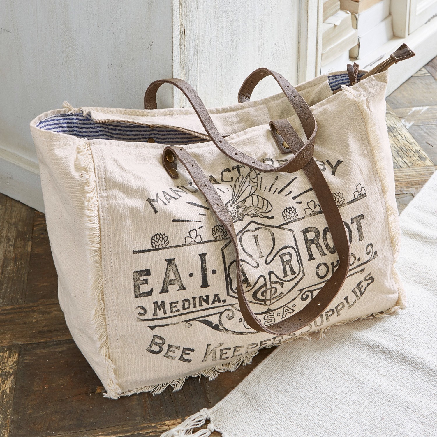 Tas Cloe Beige katoenen tas met bruine leren hengsels en bijenprint, praktische boodschappentas