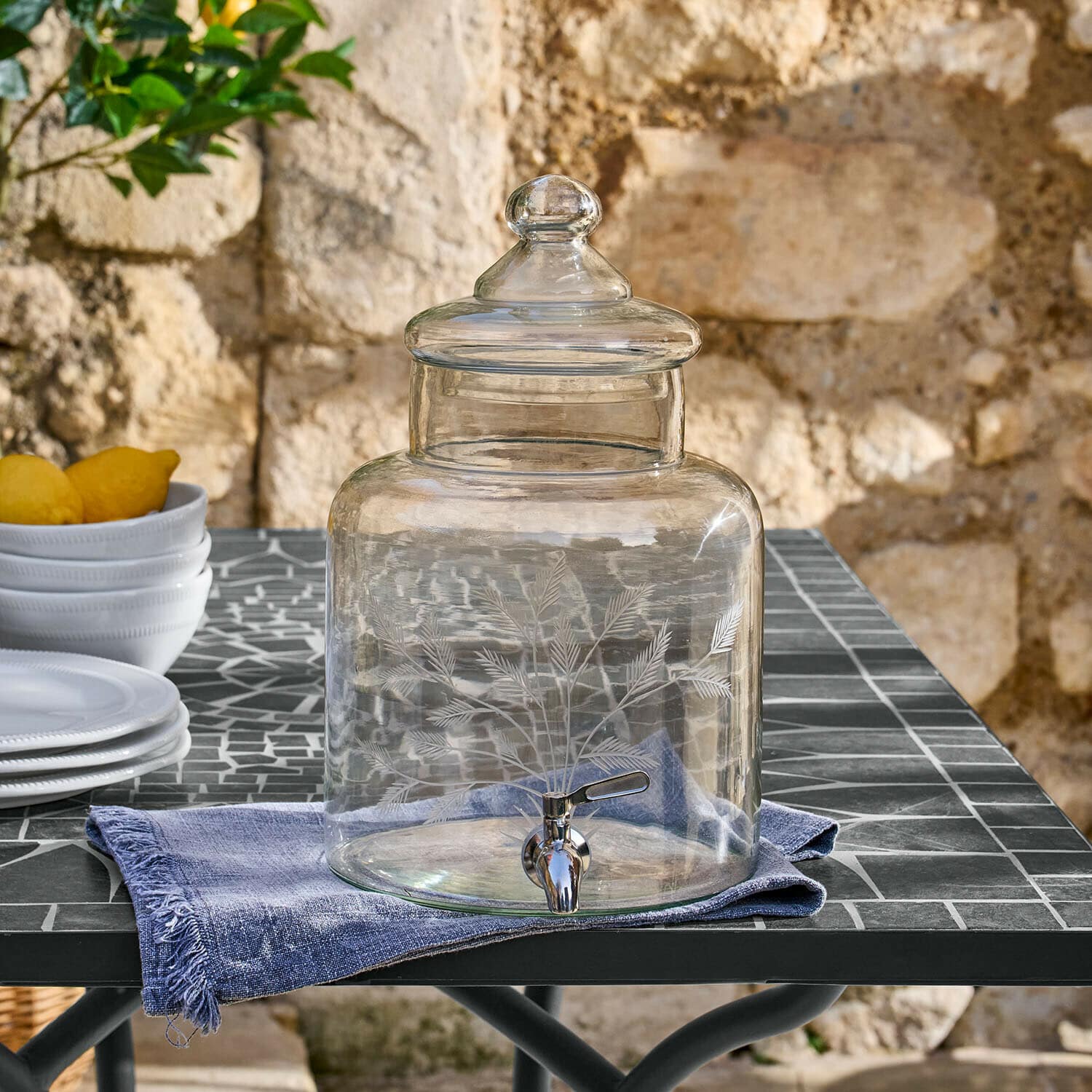 Distributeur de boisson Cirellis Distributeur de boissons en verre transparent avec couvercle et robinet, décor gravé de feuilles