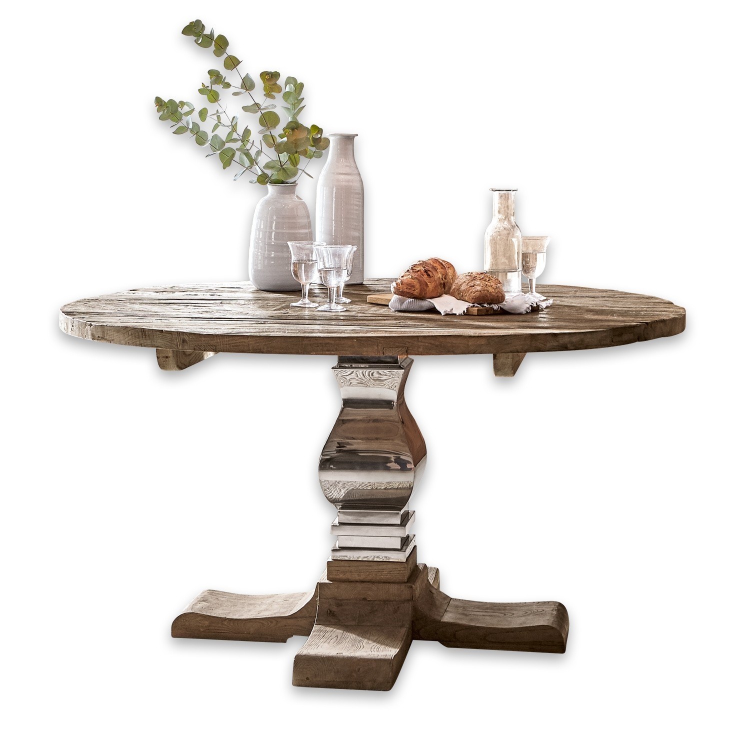 Table ronde en bois avec pied en métal, décorée de vases et de pains sur le dessus