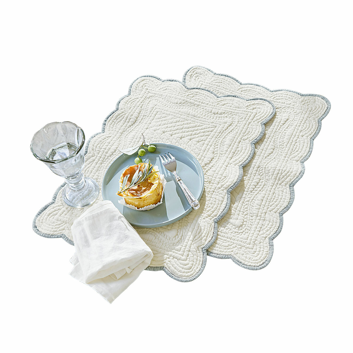 Ensemble de deux sets de table en coton crème avec quilting décoratif et bordure grise
