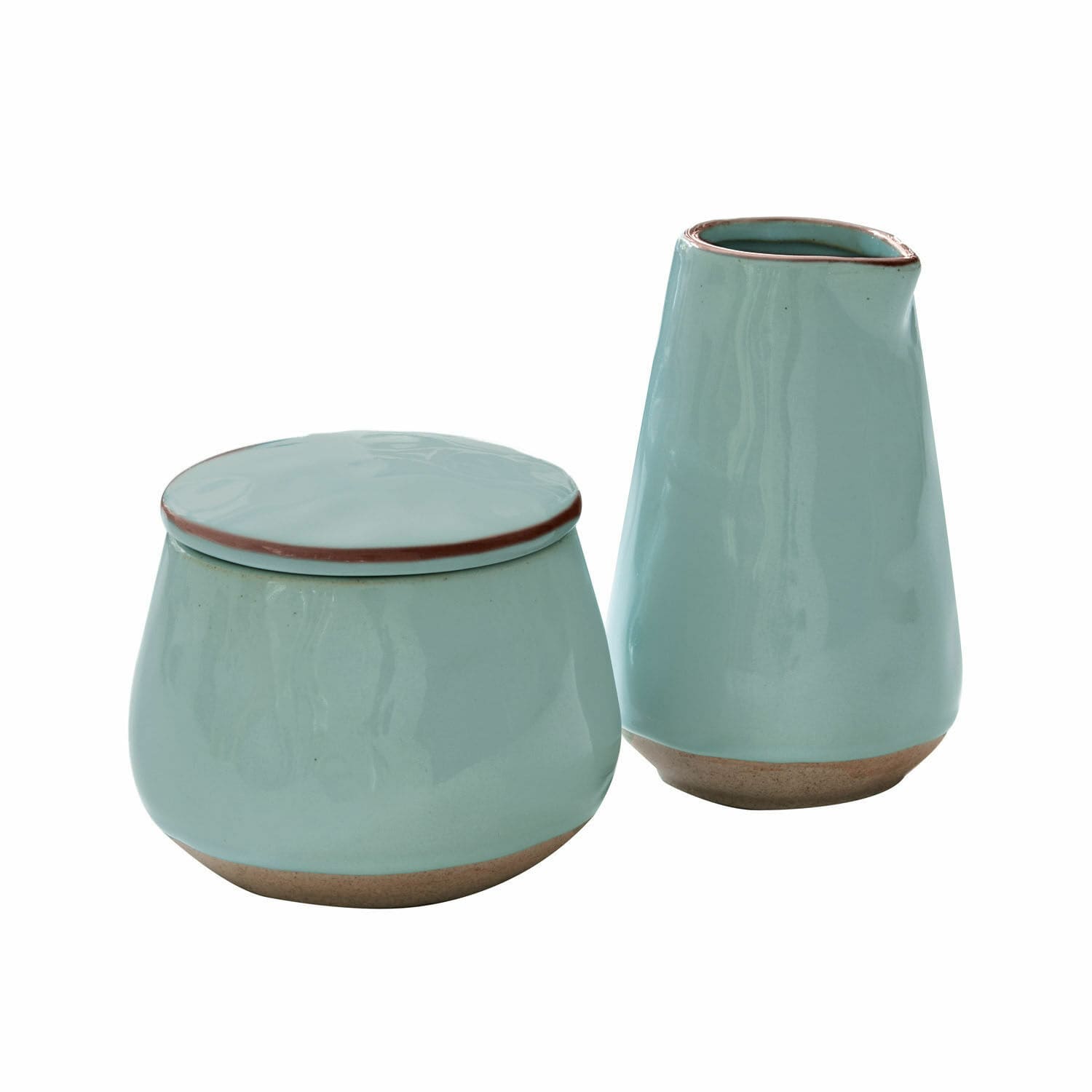 Turquoise keramische suikerpot en melkkan met natuurlijke bruine bodem