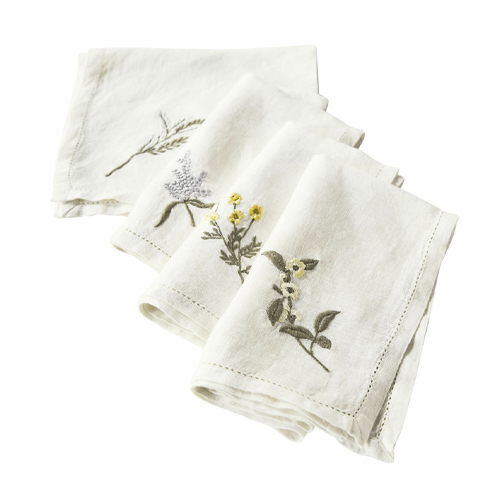 Serviettes en lin blanc avec broderies florales, élégantes pour une décoration de table raffinée