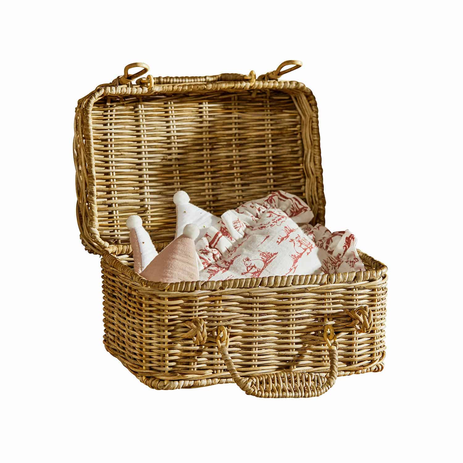 Malle Fableton Panier en osier ouvert avec tissu à motifs rouges et décorations douces pastel à l'intérieur