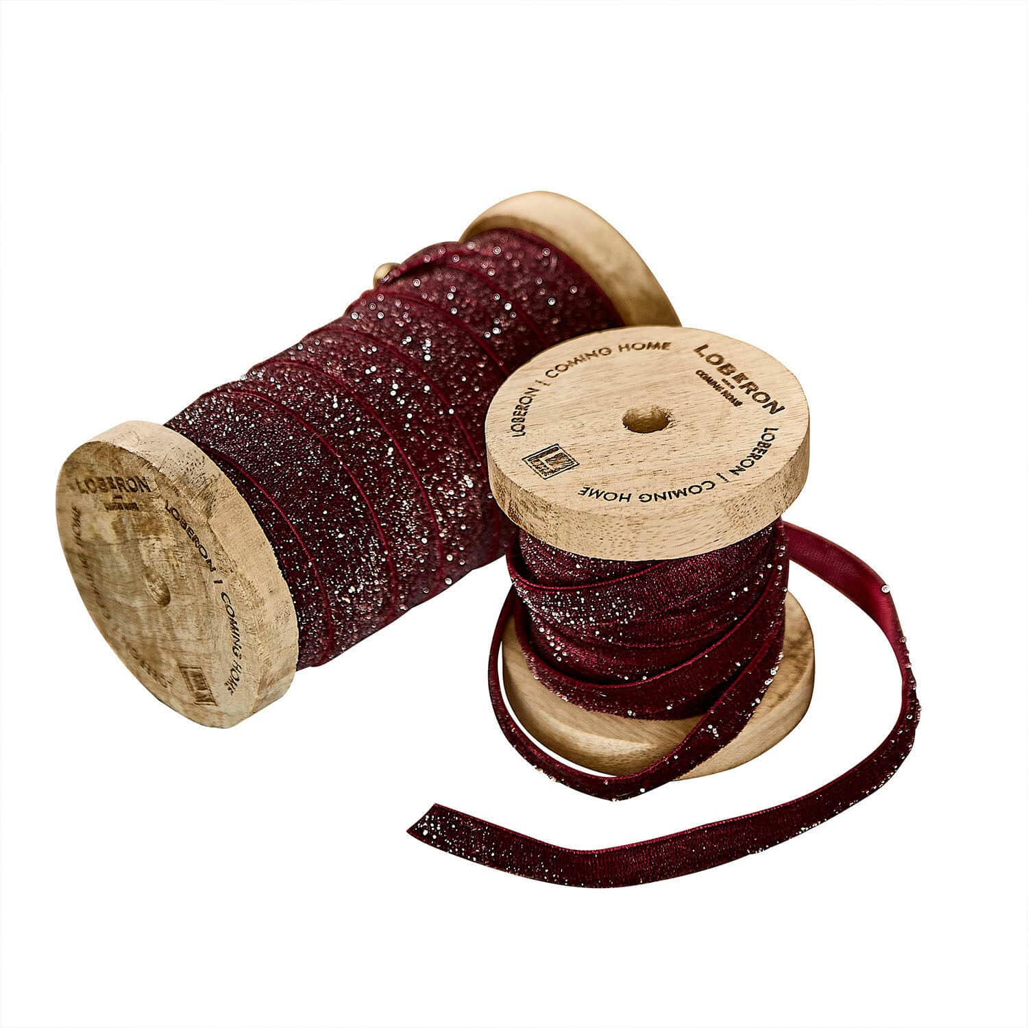 rood Set van twee rode fluwelen linten met glitters op houten spoelen voor decoratie