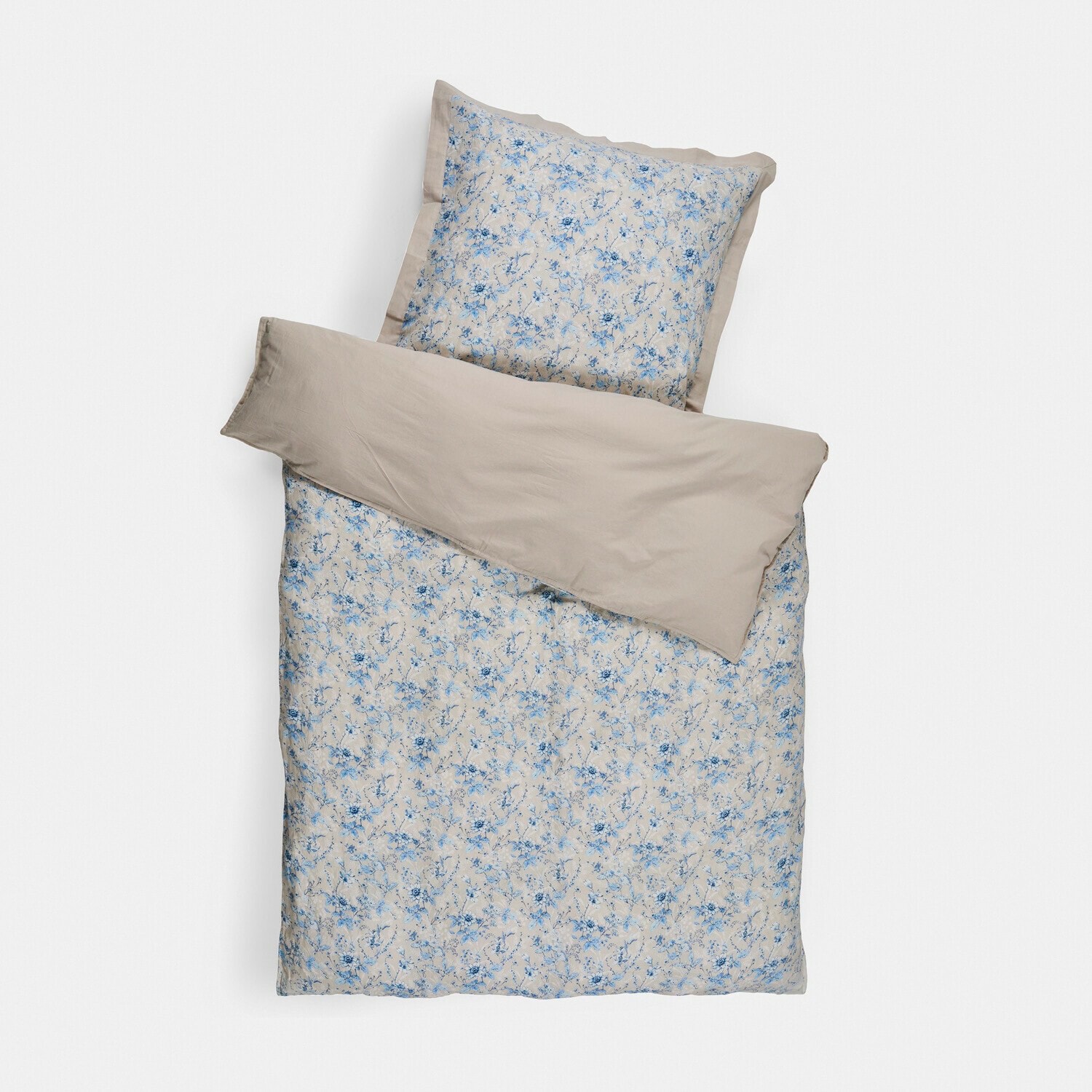 Parure de lit en coton beige avec motif floral bleu, comprenant housse de couette et taie d'oreiller